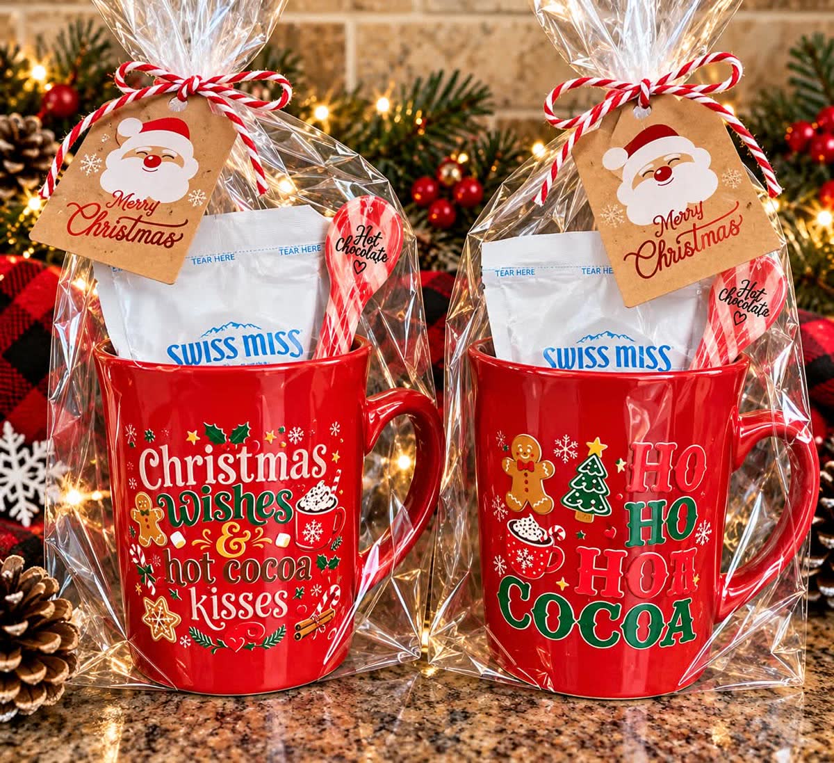 Red Christmas mugs filled with hot cocoa mix and candy canes, wrapped with Merry Christmas tags
