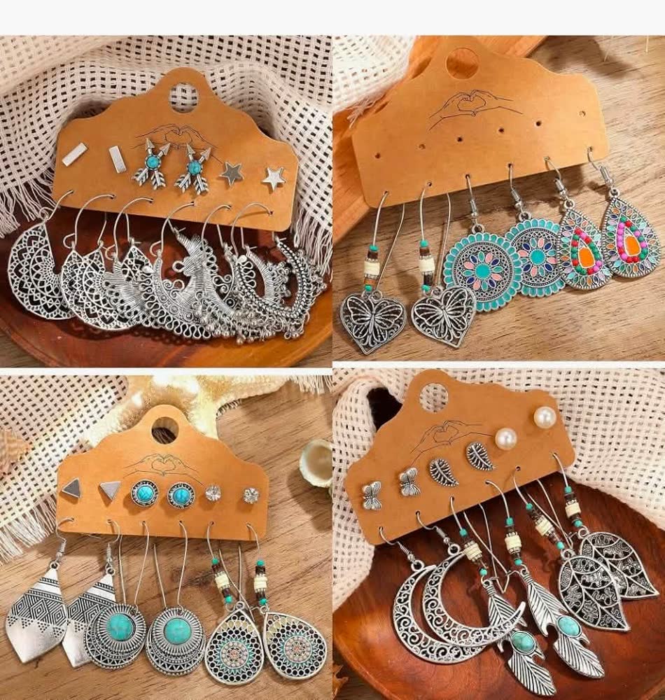 Cards of silver boho earring sets with moon, heart, turquoise and filigree designs