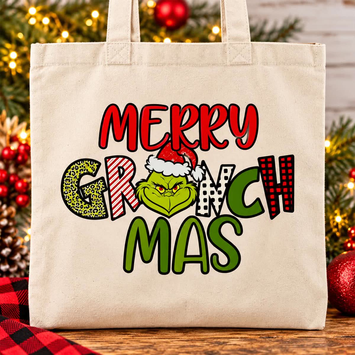 Canvas tote bag printed with colorful Merry Grinchmas lettering