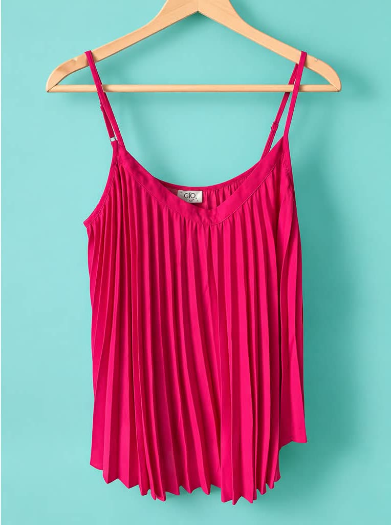Hot pink pleated camisole with thin straps on a pink hanger