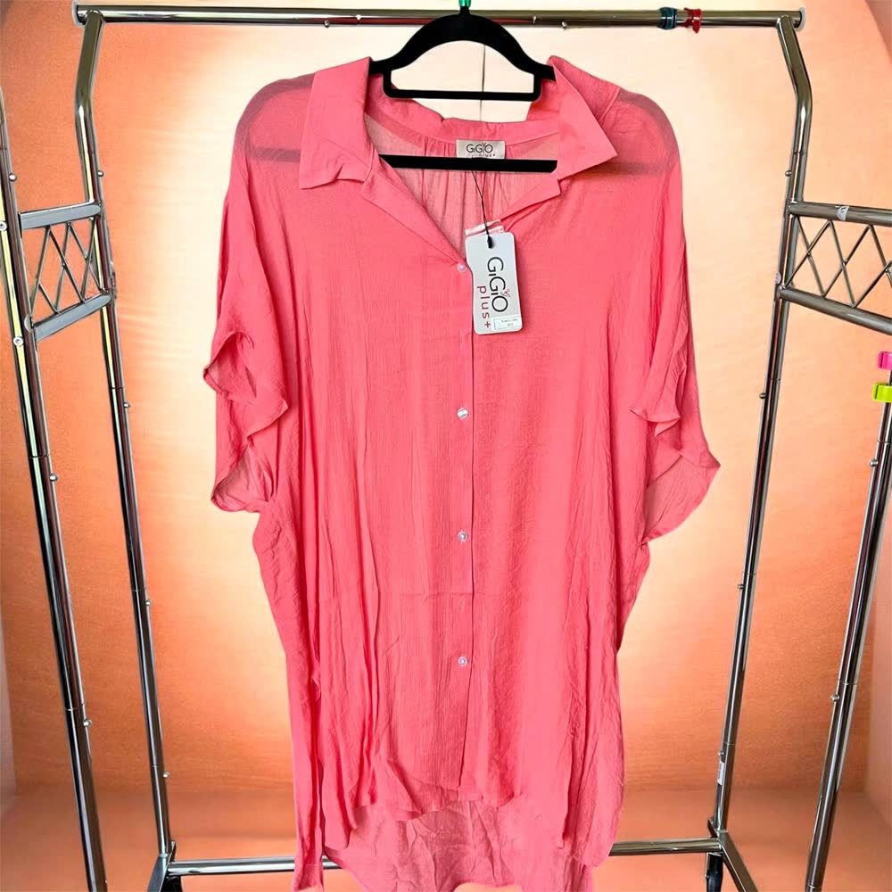 Coral pink button-front tunic with a collar and short sleeves