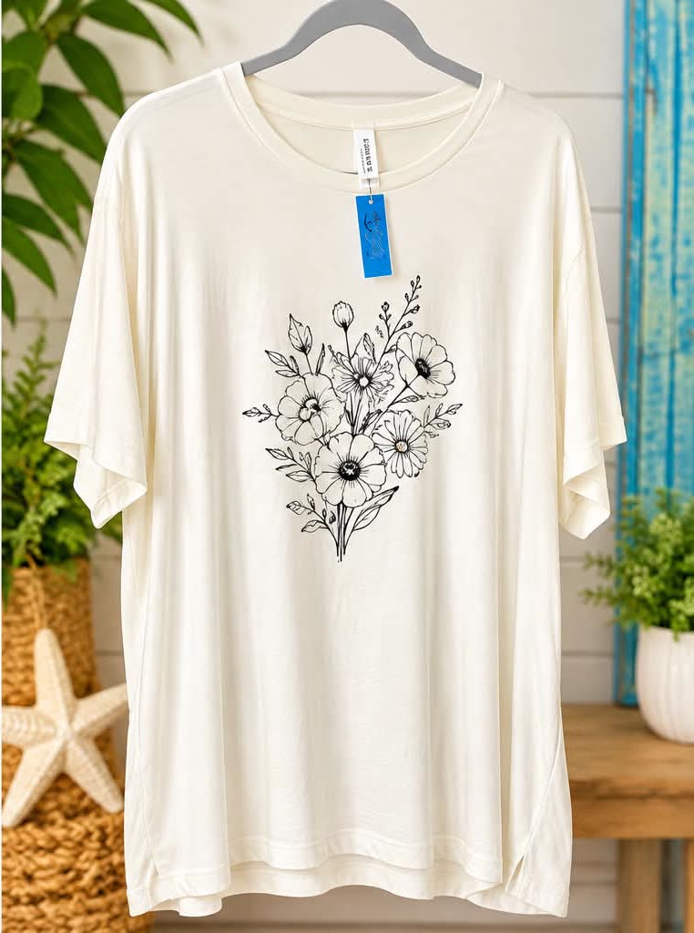 Cream short-sleeve tee with a black line drawing of a wildflower bouquet