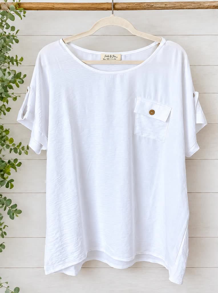 Loose white short-sleeve tee with a chest pocket and a wooden button