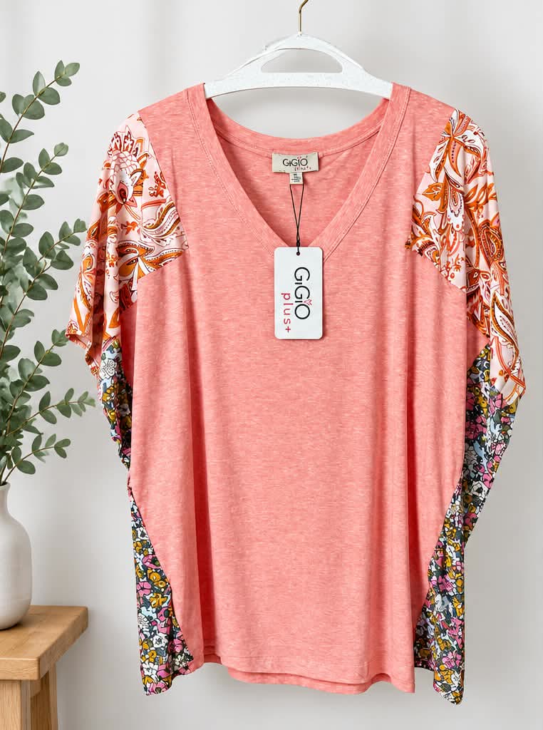 Coral V-neck tunic with orange floral print sleeves