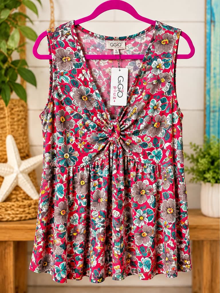 Sleeveless red and teal floral top with a twist front